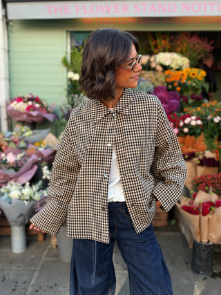 Veste à carreau noir et beige